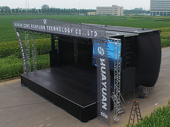 Heavy-duty event stage trailer with wind-resistant structure and banner frame